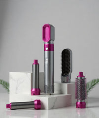 Hair styling tool with multiple attachments on a white background