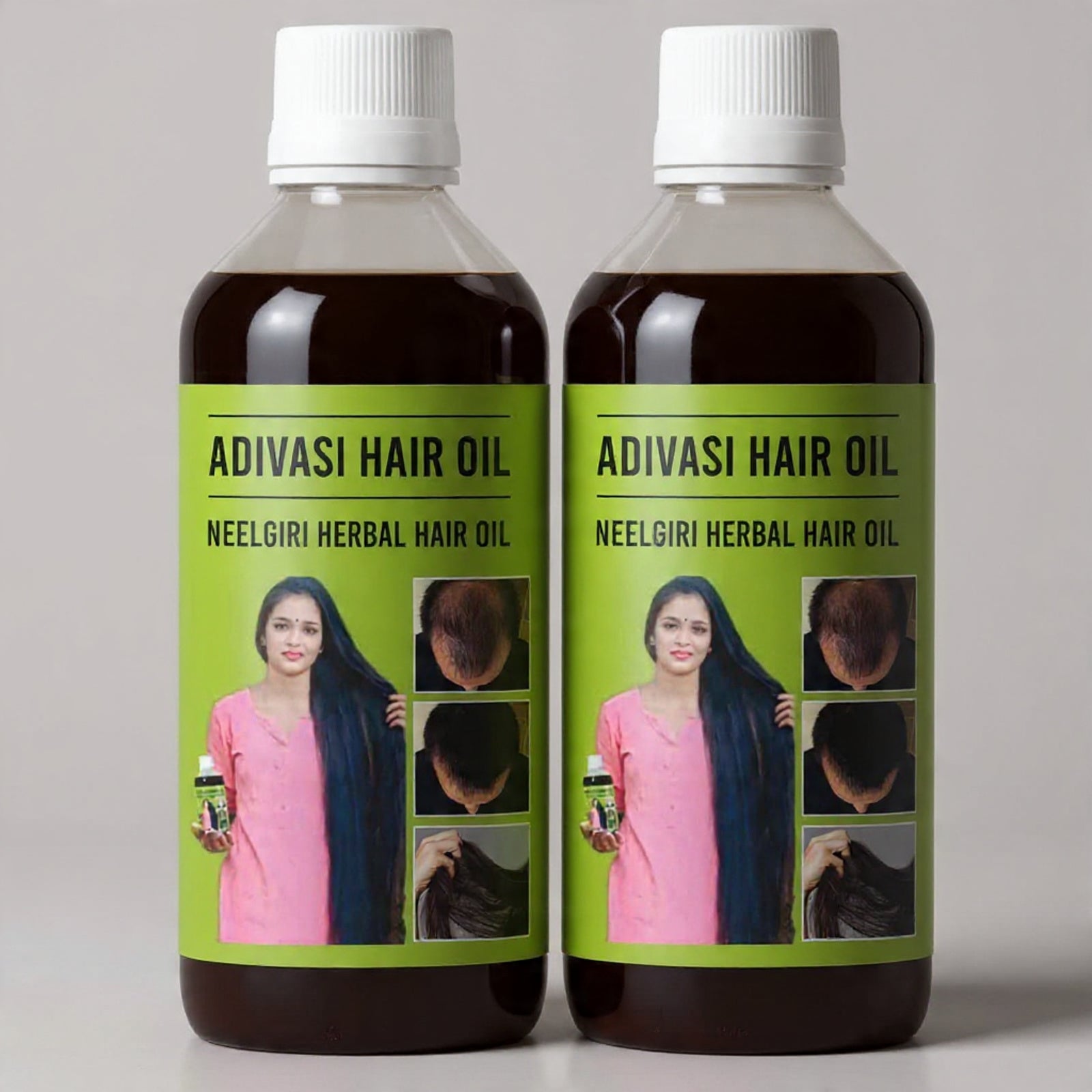 Two bottles of Adivasi Hair Oil with green labels on a gray background