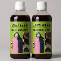Two bottles of Adivasi Hair Oil with green labels on a gray background
