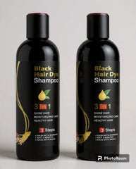 Two bottles of Black Hair Dye Shampoo on a light gray background