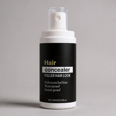 Hair concealer bottle with black label on a gray background