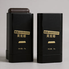 Two black hair styling products with gold text on a gray background